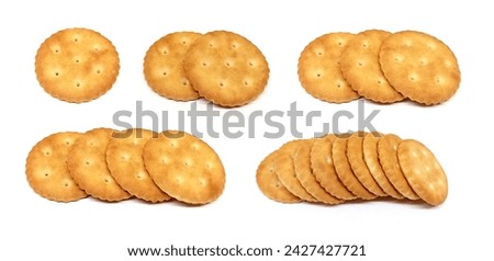 Round saltine crackers on white background