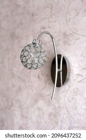 Round Sconce Made Of Crystals On Pink Wall