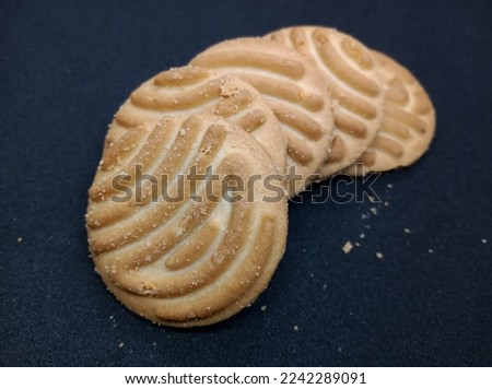 Round shape Indian biscuits on black background popularly known as Chai-biscuit in India