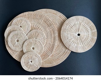 Round Shape Woven Rattan Placemat On Black Background, Handmade Kitchenware, Weave Craft Product 