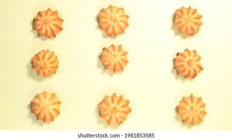 Round Shortbread Cookies On A Yellow Background. Top View.