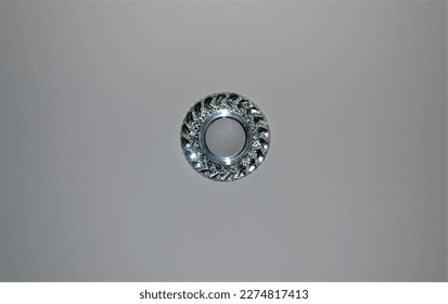 The round silver light bulb in the ceiling does not light