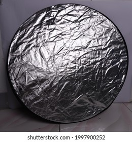 Round Silver Photo Reflector With With Background