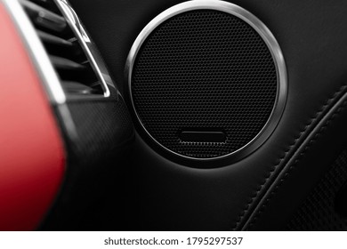 Round speaker at the panel of modern car