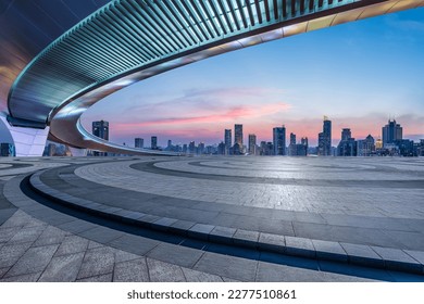 Round square floor and bridge with city skyline at sunset in Shanghai, China. - Powered by Shutterstock