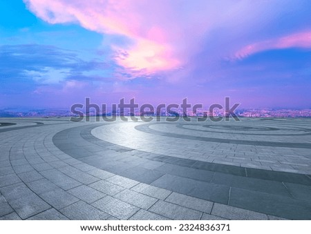Round square floors and city skyline with sky clouds at sunset