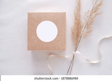 Round sticker mockup on gift box, wedding favor box and blank sticker label, adhesive address label, thank you tag. - Shutterstock ID 1878886984