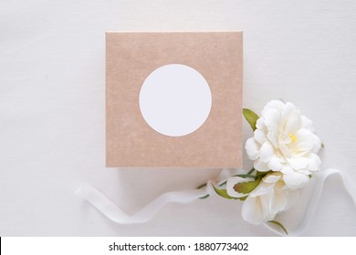 Round sticker mockup on gift box, wedding favor box and blank sticker, adhesive label, thank you tag.	 - Shutterstock ID 1880773402