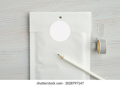 Round Sticker Mockup On White Bubble Paper Envelope, Circle Label Mock Up For Design Presentation On Post Package.