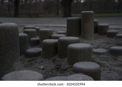 Round Stone Pillars At Children's  Playground 