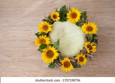 Round Sunflower Wreath On The Wooden Floor