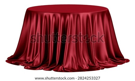 Round table covered with elegant deep red satin fabric tablecloth