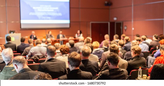 Round Table Discussion At Business Convention And Presentation. Audience At The Conference Hall. Business And Entrepreneurship Symposium.