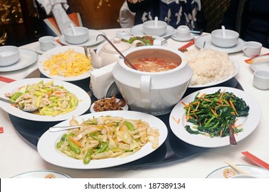 Round Table Full Of Chinese And Thai Food.