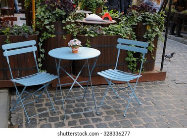 Round Table And Two Chairs