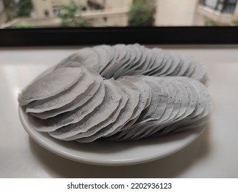 Round Tea Bag On White Plate