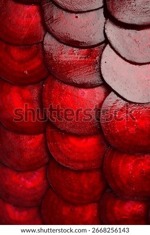 Round textured slices of beetroot. Macro photo of beetroot. Top view. Vertical photo.