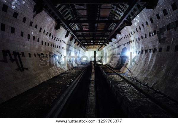 Round tiled tunnel in abandoned\
underground nuclear physics laboratory, Sukhum,\
Abkhazia