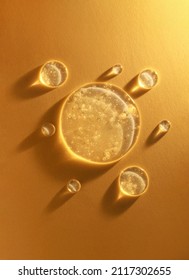 round transparent drop of clear gel serum on gold background - Shutterstock ID 2117302655
