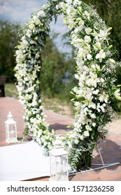 Round Wedding Arch Decorated With White Flowers