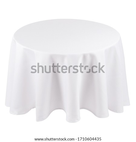 Round white tablecloth over the table isolated on white background