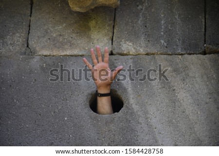 Image, Stock Photo Child hand reaches through a hole in a concrete wall