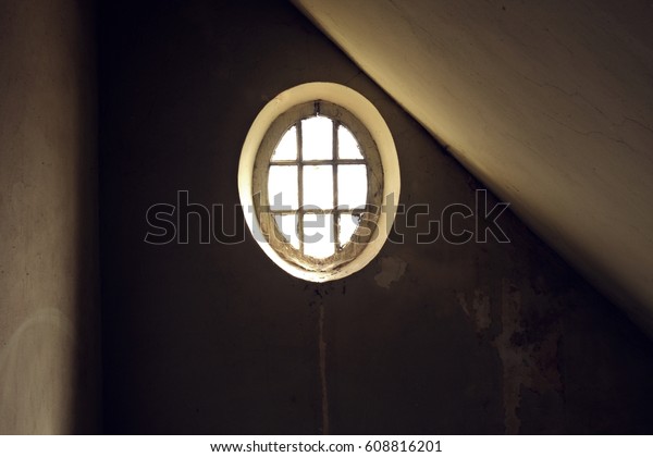 Round window on the\
stairwell