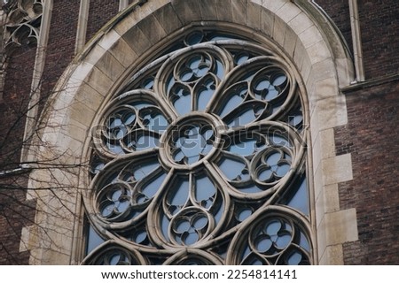 Round window with stained glass on facade of the building. Baroque and Gothic architecture. Church of St. Olga and Elizabeth. Lviv, Ukraine. Stock photo © 
