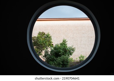 round window tree and house - Powered by Shutterstock