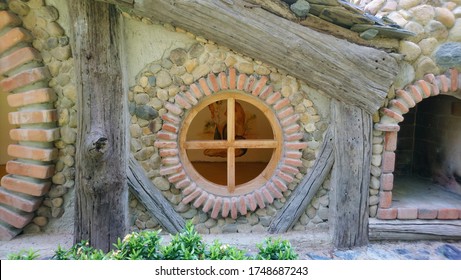 The round windows of the Hobbit House. Built of bricks and wood.