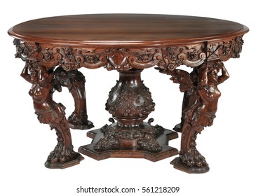 Round Wood Table With Ornate Carvings Isolated On White.