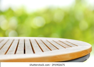 Round Wood Table Top On Green Bokeh Abstract Background - Can Be Used For Display Or Montage Your Products