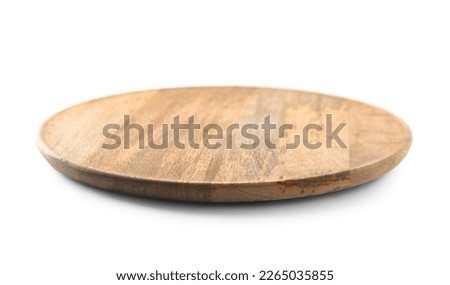 Round wooden board on light table