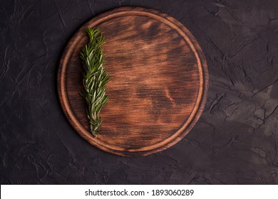 Round Wooden Cutting Board On A Black Table. Top View Of Empty Kitchen Trendy Rustic Wooden Tray