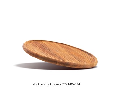 Round wooden pizza board falling on a white background. Food preparation. Culinary background.