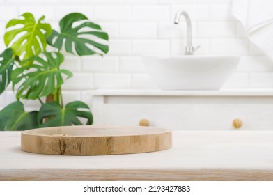 Round wooden podium for product display on blurred bathroom background - Shutterstock ID 2193427883
