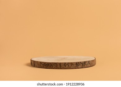 Round wooden saw cut cylinder shape for product presentation on a beige background. Round geometric shape of the cylinder. eco style and minimalism. wood slice - Shutterstock ID 1912228936