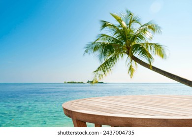 Round wooden table for product montage with tropical sea landscape of palm and island away - Powered by Shutterstock