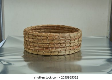 A Round Woven Basket To Store Various Things           