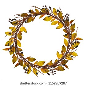 Round wreath from dry twigs and yellow autumn with black berries isolated on white background. Flt lay. Top view.