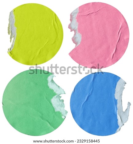 Round yellow, pink, green and blue paper stickers with torn edge on white background with clipping path