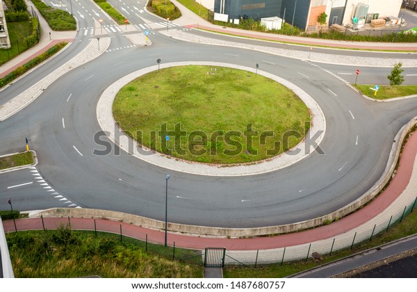 a roundabout, also called a traffic circle, road\
circle, rotary