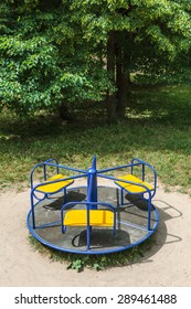 Roundabout In Empty Child Playground