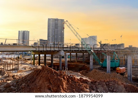 Roundabout and traffic bridge construction. Construction highway ramps and bridgeworks. Crane for formwork on bridge project works. Road work on traffic highway, road intersection junction and freeway Stock foto © 