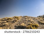 Rounded False Summit Against Blue Sky On Wild Rose Peak In Death Valley National Park