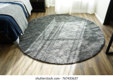 Rounded Grey Carpet In Bedroom