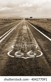 The Route 66 Logo On The Roadway In Arizona.