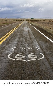 The Route 66 Logo On The Roadway In Arizona.