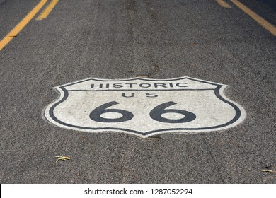 Route 66 Sign On Road In Kingman, AZ