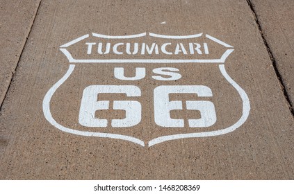 Route 66, Tucumcari US, New Mexico. Sign Badge On The Road, Sunny Day. Route 66 The Classic Historic Roadtrip In USA